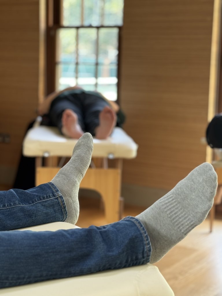 Patients feet as they relax at The Get Well Clinics during acupuncture treatments